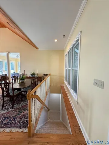 a view of a hallway with seating space