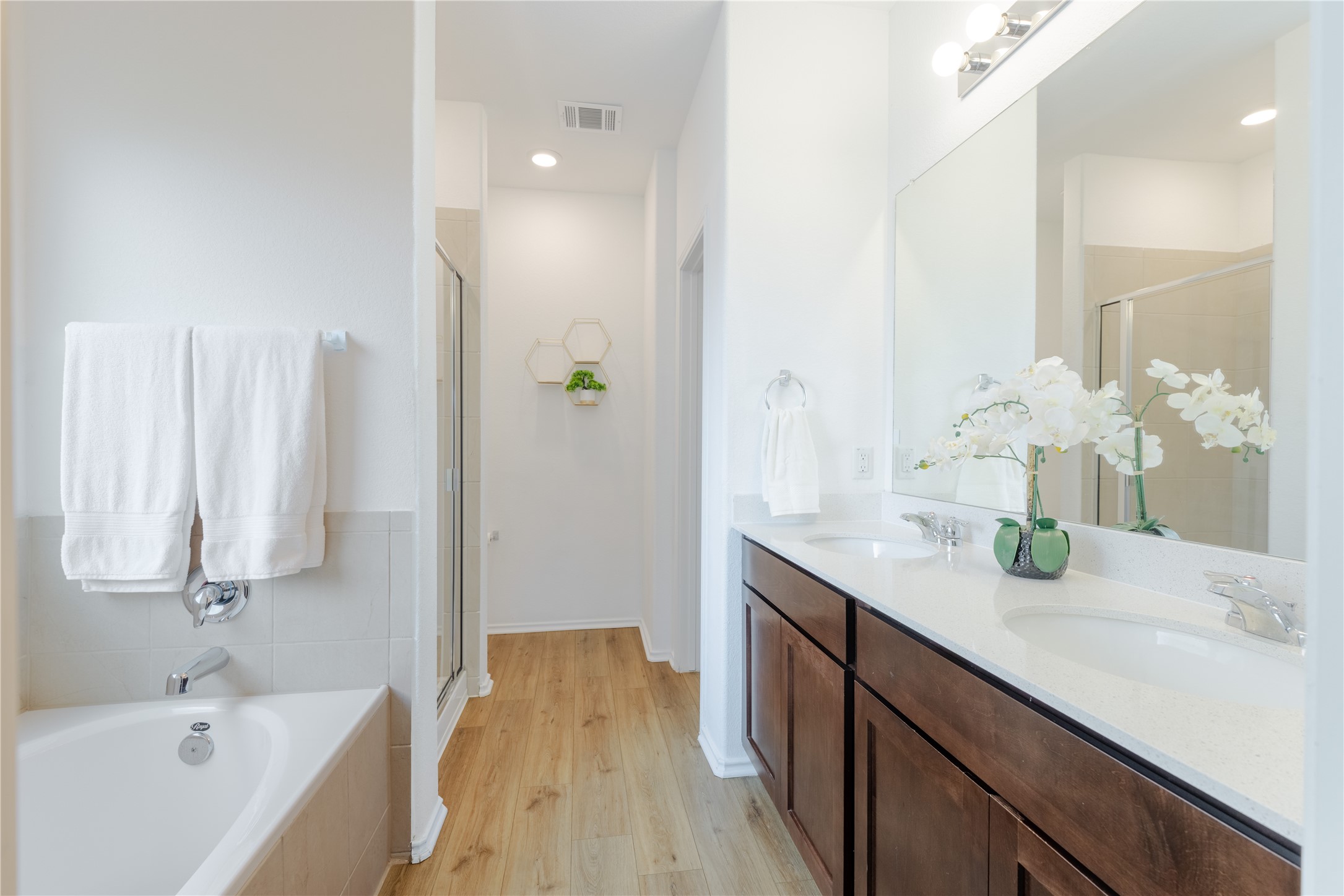 425 Perfect World Loop Jarrell, TX 76537 - Photo 12 of 29 Bathroom featuring a dual-sink vanity with wood-finish cabinetry and a white countertop
