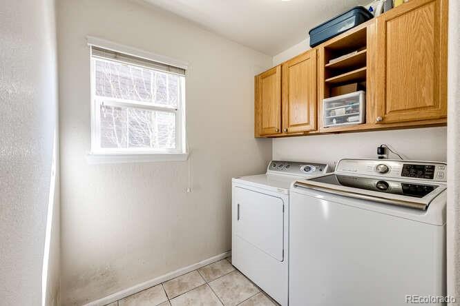 10143 Astorbrook Lane Highlands Ranch, CO 80126 - Photo 13 of 39 a utility room with dryer and washer