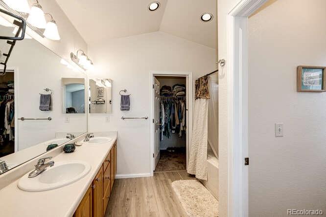 10143 Astorbrook Lane Highlands Ranch, CO 80126 - Photo 18 of 39 a en suite bathroom with a sink and a mirror