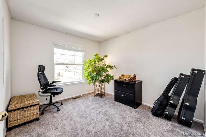 10143 Astorbrook Lane Highlands Ranch, CO 80126 - Photo 21 of 39 a view of a workspace with furniture and a window