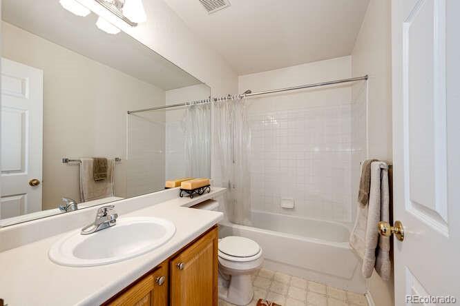 10143 Astorbrook Lane Highlands Ranch, CO 80126 - Photo 22 of 39 a bathroom with a sink toilet and shower