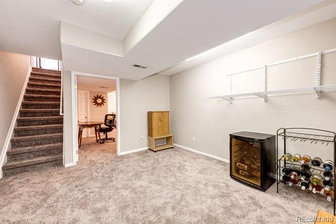 10143 Astorbrook Lane Highlands Ranch, CO 80126 - Photo 23 of 39 a view of a livingroom with furniture and staircase