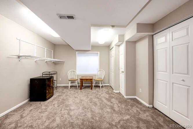 10143 Astorbrook Lane Highlands Ranch, CO 80126 - Photo 24 of 39 a view of kitchen with furniture and a refrigerator