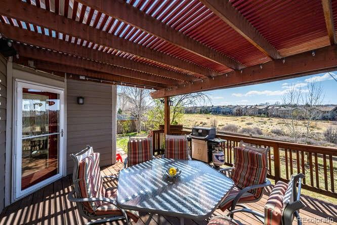10143 Astorbrook Lane Highlands Ranch, CO 80126 - Photo 29 of 39 a view of a patio with wooden floor