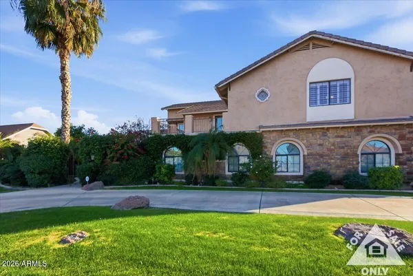 a front view of house with yard and green space