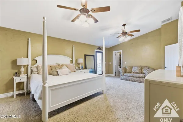 a living room with furniture and chandelier