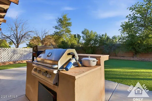 a view of a swimming pool with a yard