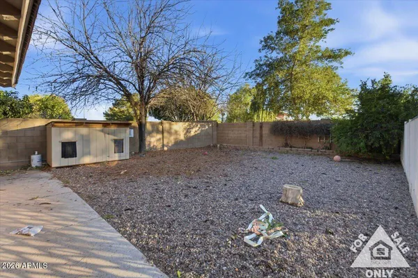 a view of a swimming pool with a yard
