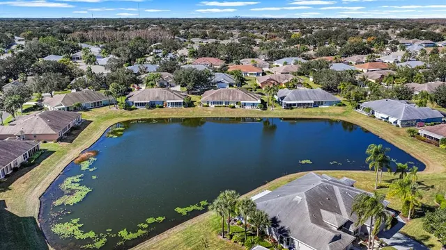 a front view of a house with a lake view
