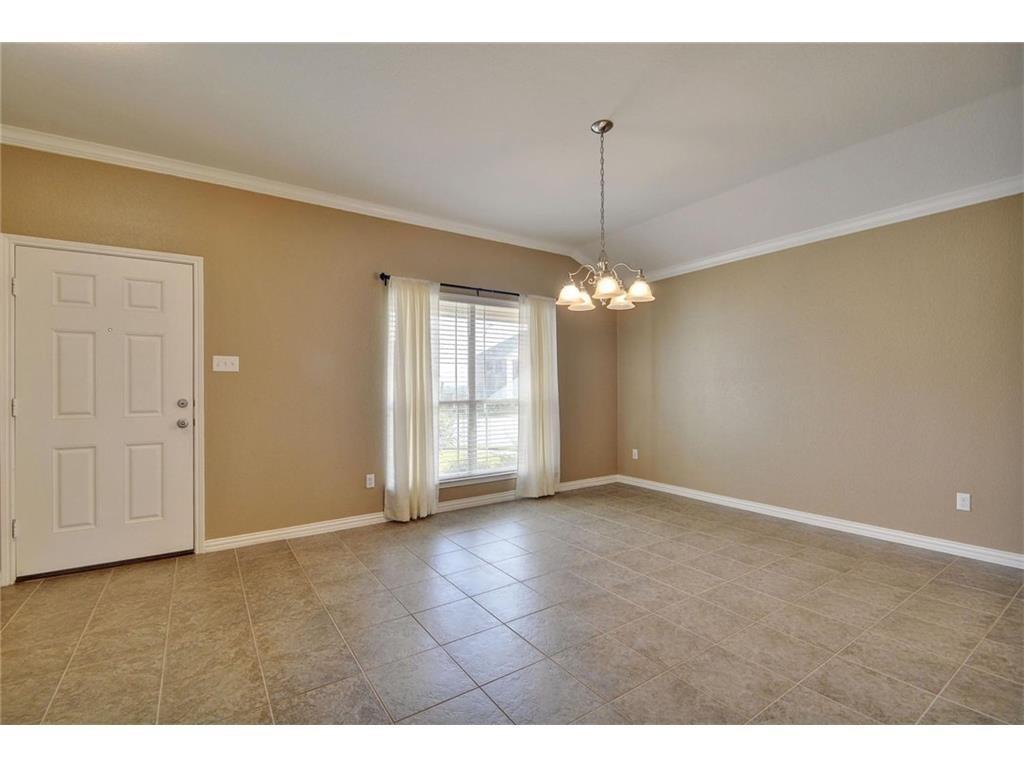 2109 Granite Springs Road Leander, TX 78641 - Photo 9 of 30 A well-lit interior space with tile flooring and a classic ceiling fixture.
