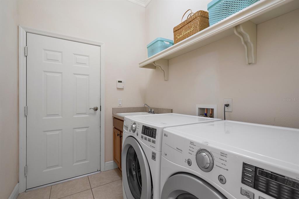 8406 Miramar Way, Unit 8406 Lakewood Ranch, FL 34202 - Photo 24 of 31 a utility room with dryer and washer