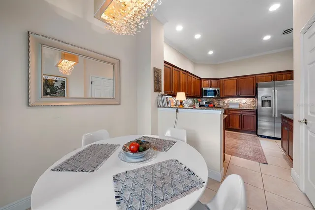 a kitchen with stainless steel appliances granite countertop a refrigerator sink and stove