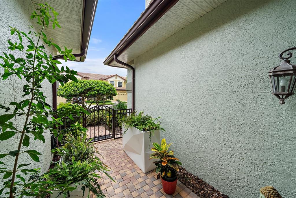 8406 Miramar Way, Unit 8406 Lakewood Ranch, FL 34202 - Photo 30 of 31 a view of a potted plants next to a wall