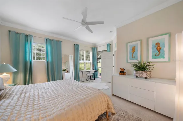 a bedroom with a large bed and a large window