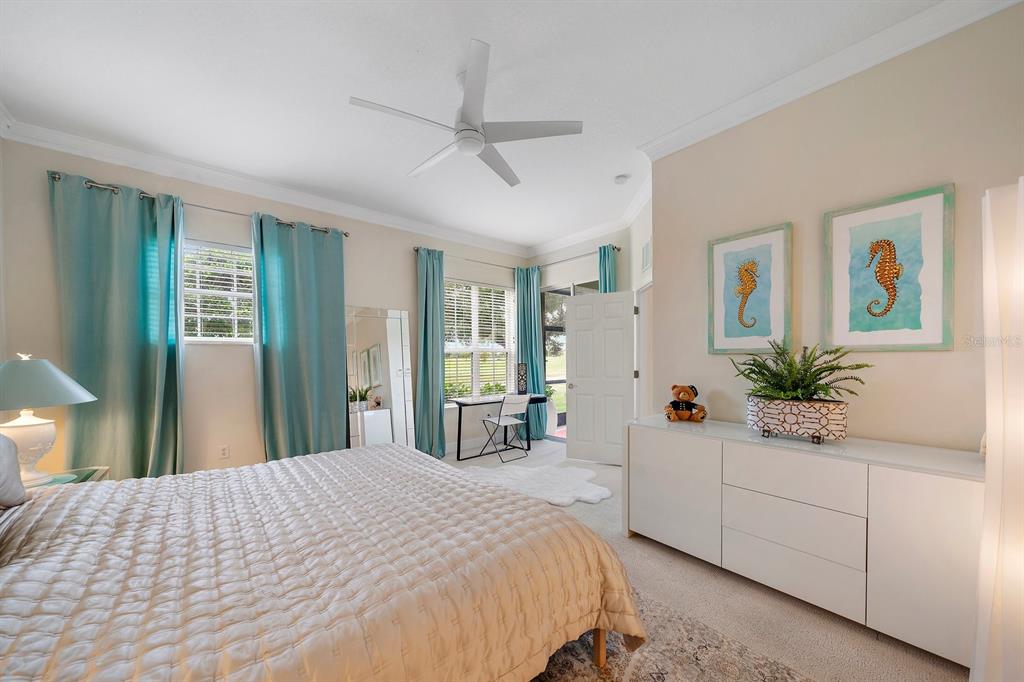 8406 Miramar Way, Unit 8406 Lakewood Ranch, FL 34202 - Photo 9 of 31 a bedroom with a large bed and a large window