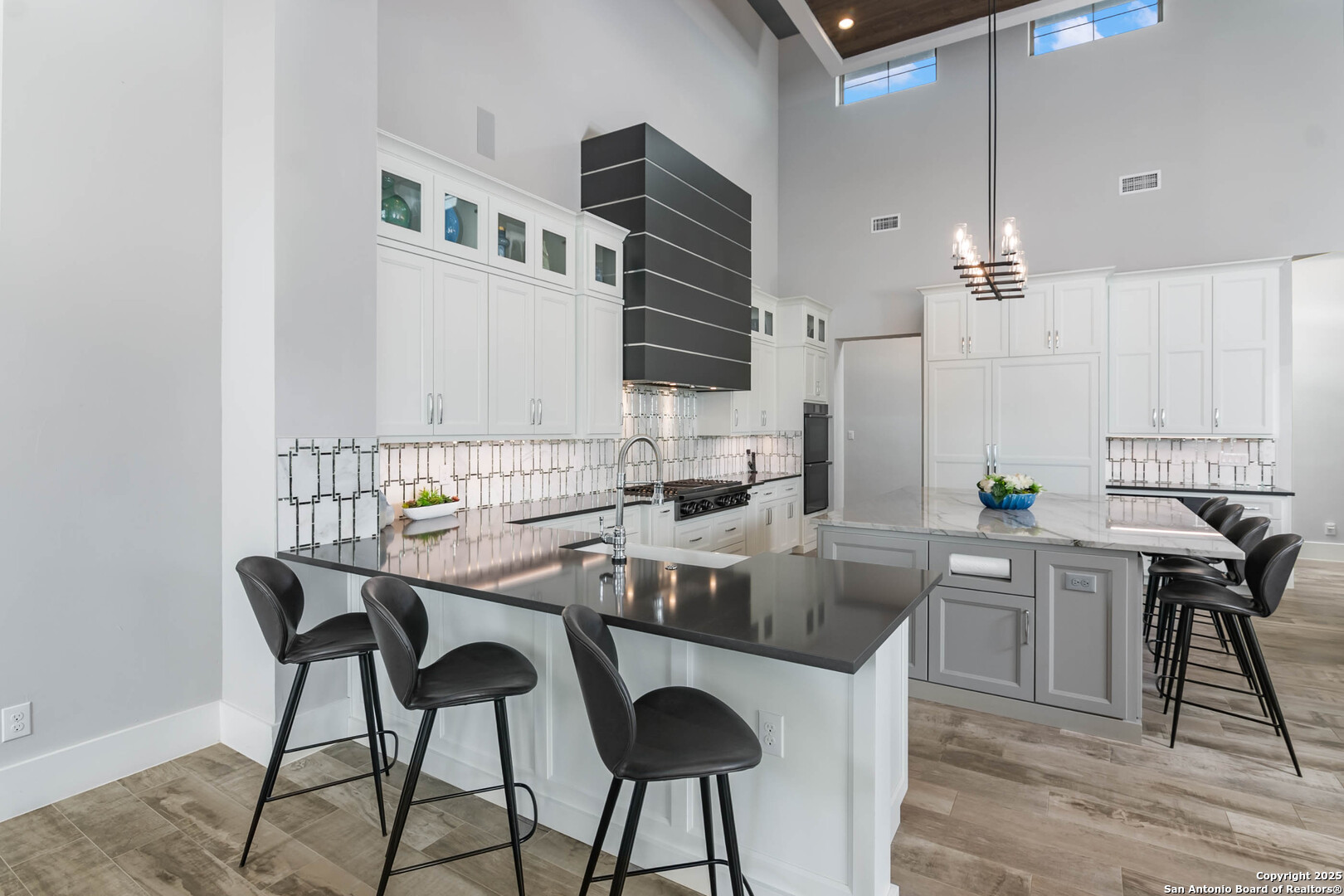 815 Brand Road Bulverde, TX 78163 - Photo 12 of 50 a kitchen with stainless steel appliances granite countertop a stove top oven a sink a counter space and cabinets