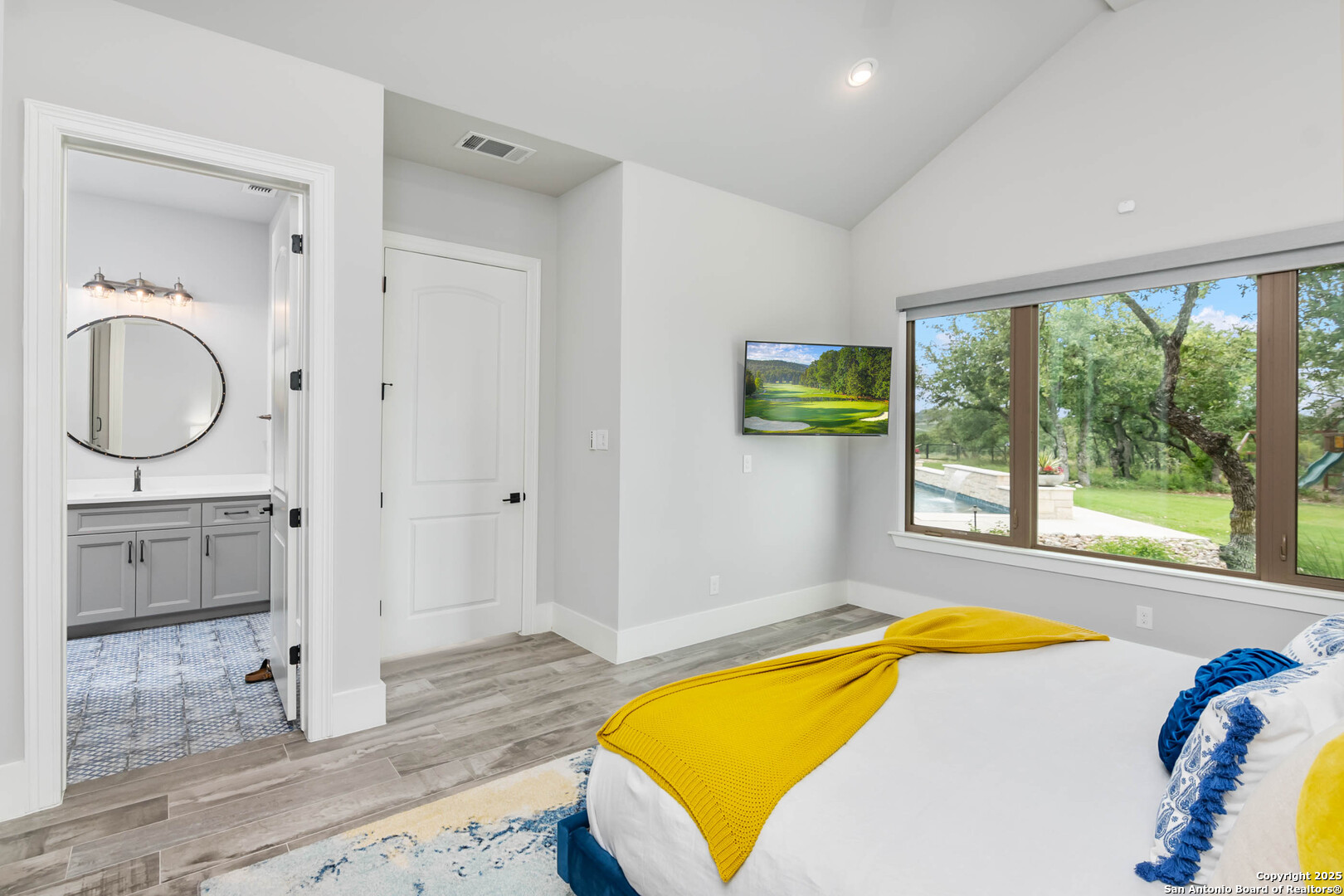 815 Brand Road Bulverde, TX 78163 - Photo 25 of 50 a bedroom with a bed and a window