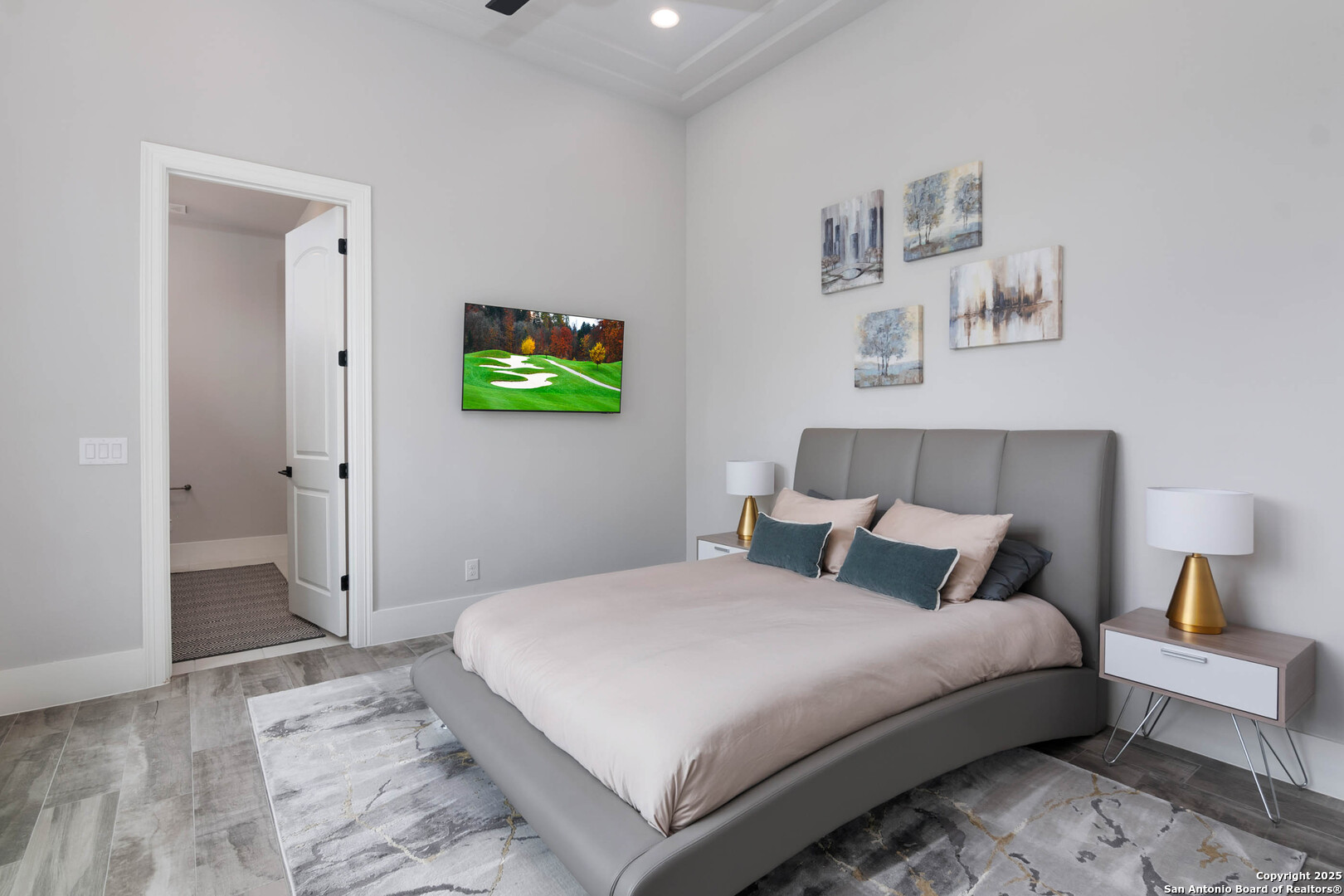 815 Brand Road Bulverde, TX 78163 - Photo 31 of 50 a bedroom with a bed and painting on the wall