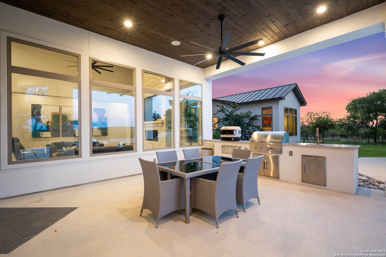 815 Brand Road Bulverde, TX 78163 - Photo 39 of 50 a view of a patio with dining table and chairs