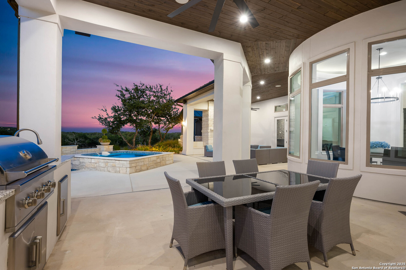 815 Brand Road Bulverde, TX 78163 - Photo 40 of 50 a view of a dining room with furniture and a potted plant
