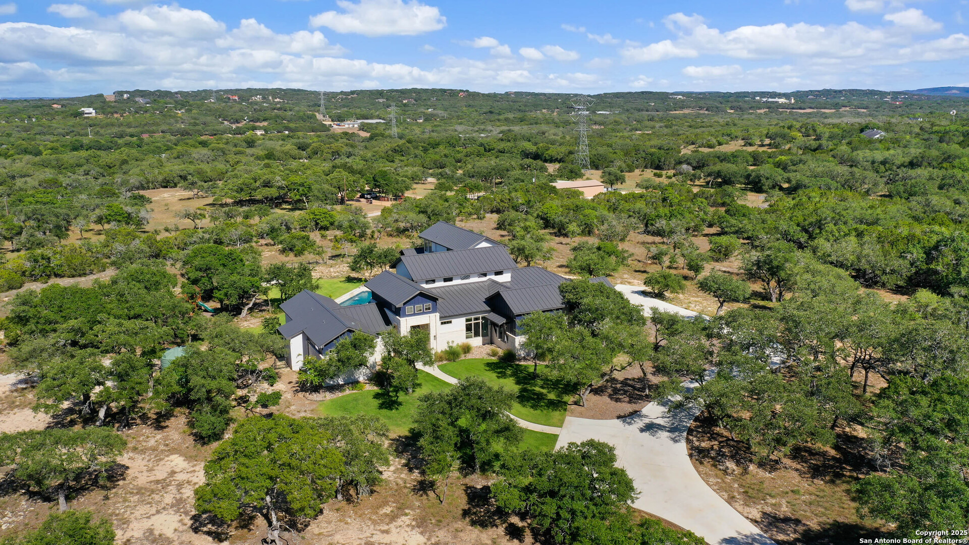 815 Brand Road Bulverde, TX 78163 - Photo 48 of 50 an aerial view of residential houses with outdoor space and trees