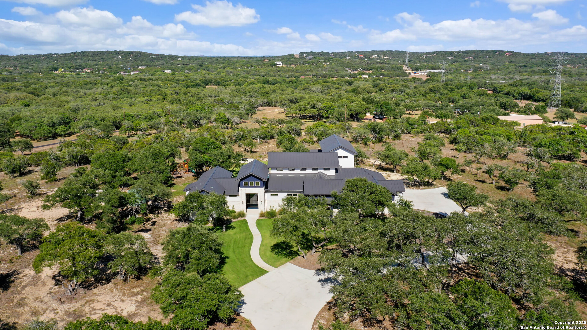 815 Brand Road Bulverde, TX 78163 - Photo 49 of 50 an aerial view of residential houses with outdoor space and trees