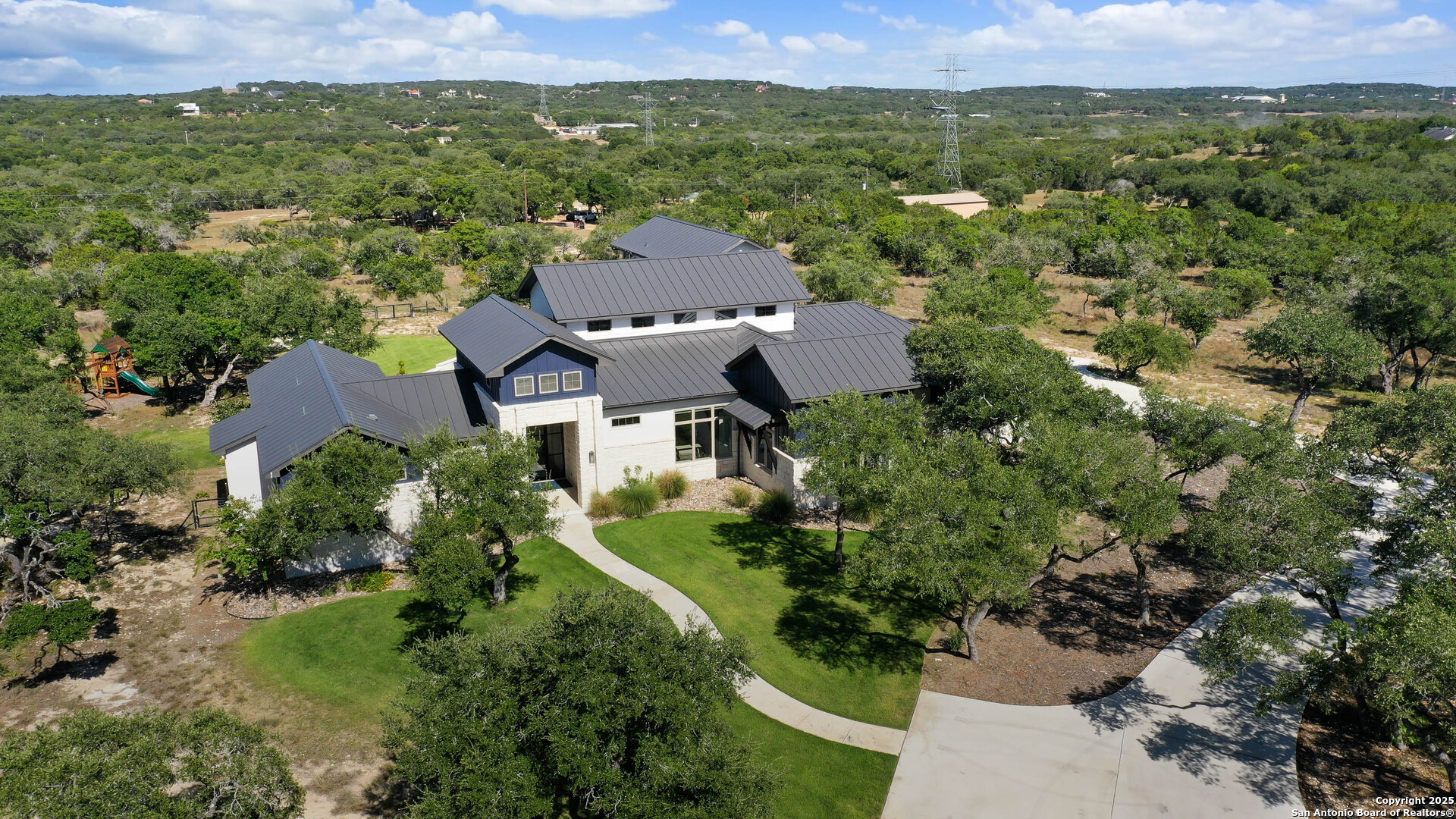 815 Brand Road Bulverde, TX 78163 - Photo 50 of 50 an aerial view of a house with a garden