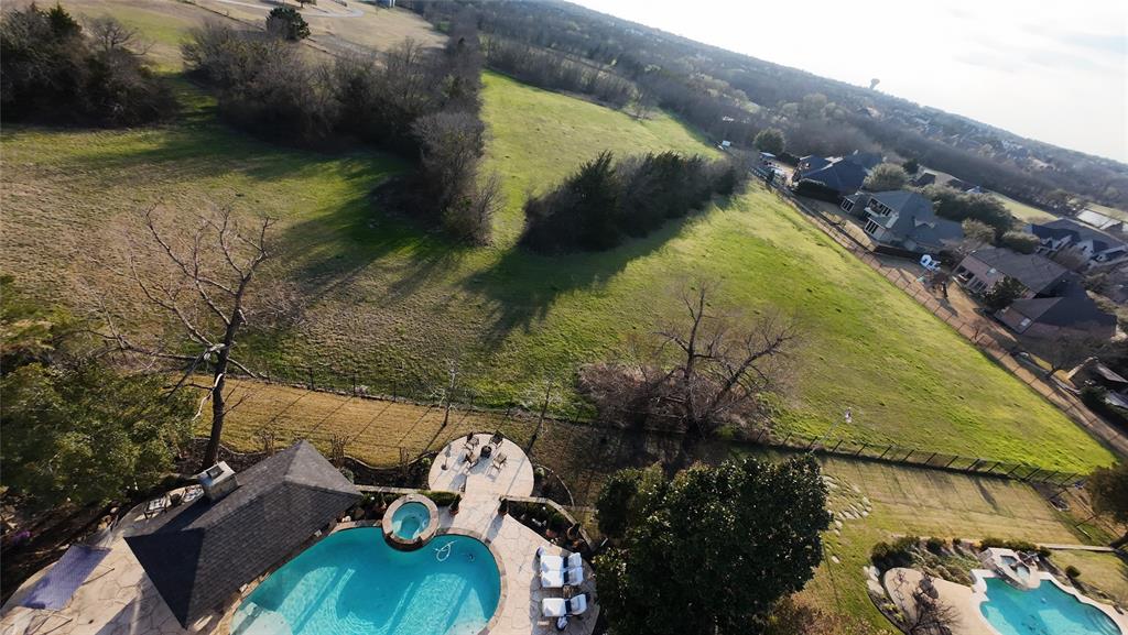 1919 Kings Pass Heath, TX 75032 - Photo 32 of 38 Aerial view of property's location featuring a pool and rural landscape