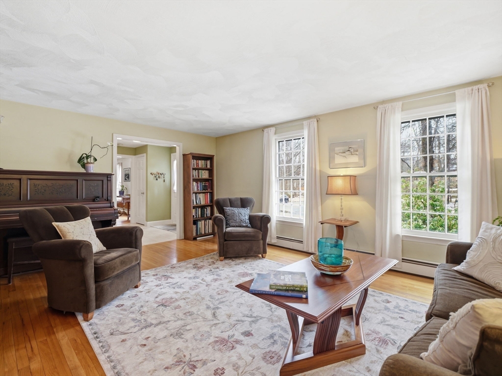 10 Berkeley Lane Andover, MA 01810 - Photo 14 of 42 a living room with furniture and a large window