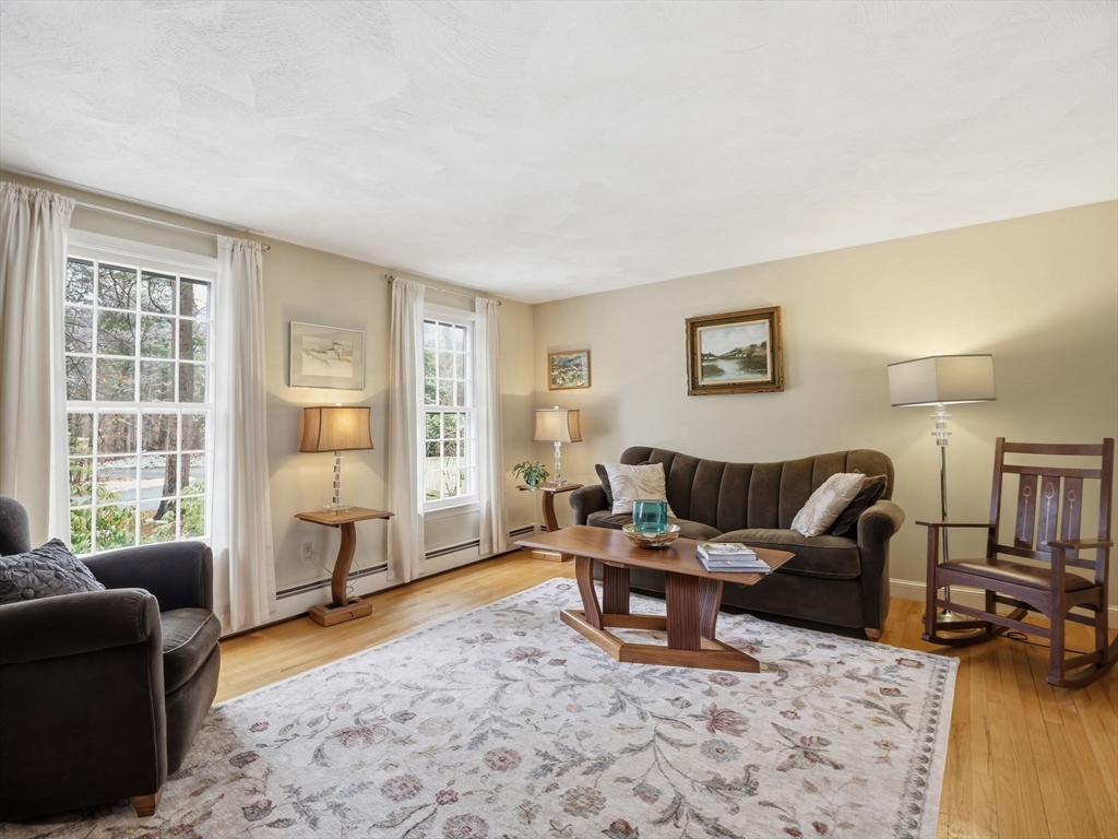 10 Berkeley Lane Andover, MA 01810 - Photo 15 of 42 a living room with furniture and a window
