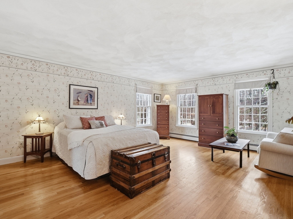 10 Berkeley Lane Andover, MA 01810 - Photo 23 of 42 a spacious bedroom with a bed wooden floor and lamp