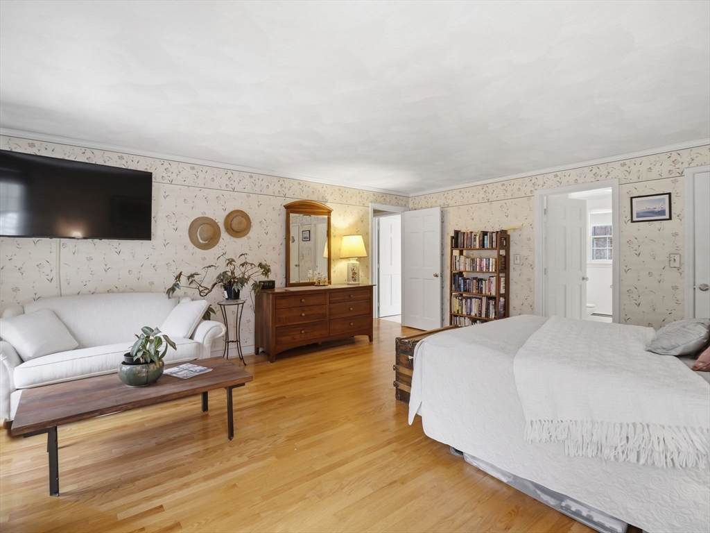 10 Berkeley Lane Andover, MA 01810 - Photo 24 of 42 a living room with furniture and a flat screen tv