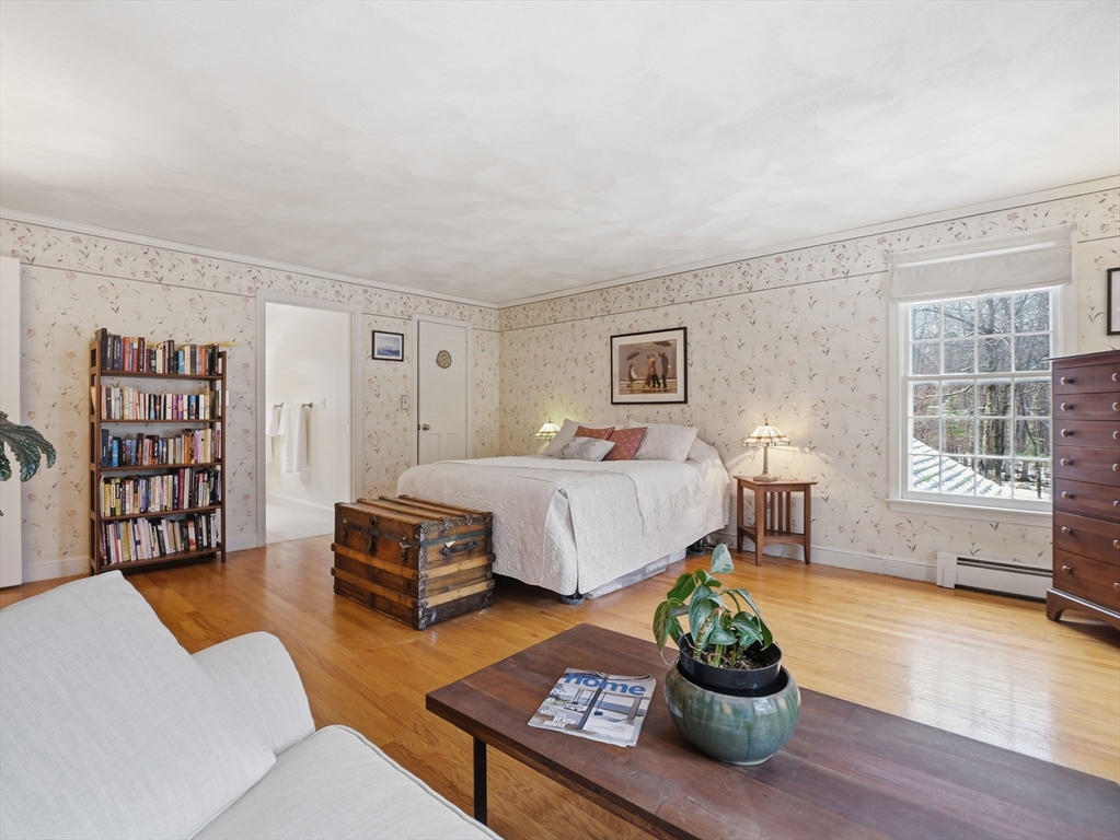 10 Berkeley Lane Andover, MA 01810 - Photo 25 of 42 a bedroom with a large bed and a couch