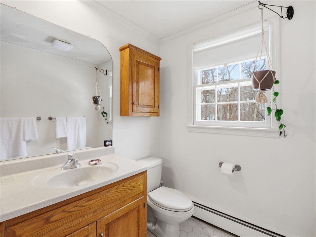 10 Berkeley Lane Andover, MA 01810 - Photo 26 of 42 a bathroom with a sink toilet and a mirror