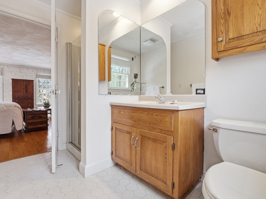 10 Berkeley Lane Andover, MA 01810 - Photo 27 of 42 a bathroom with a sink a toilet and a mirror