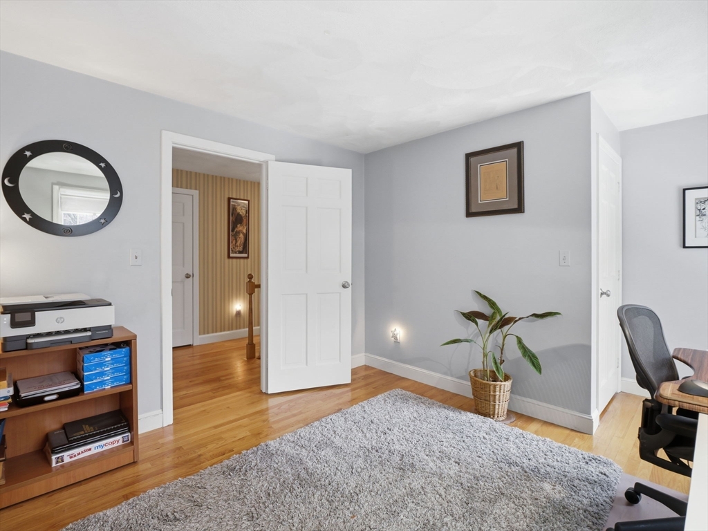 10 Berkeley Lane Andover, MA 01810 - Photo 29 of 42 a bedroom with furniture and a window