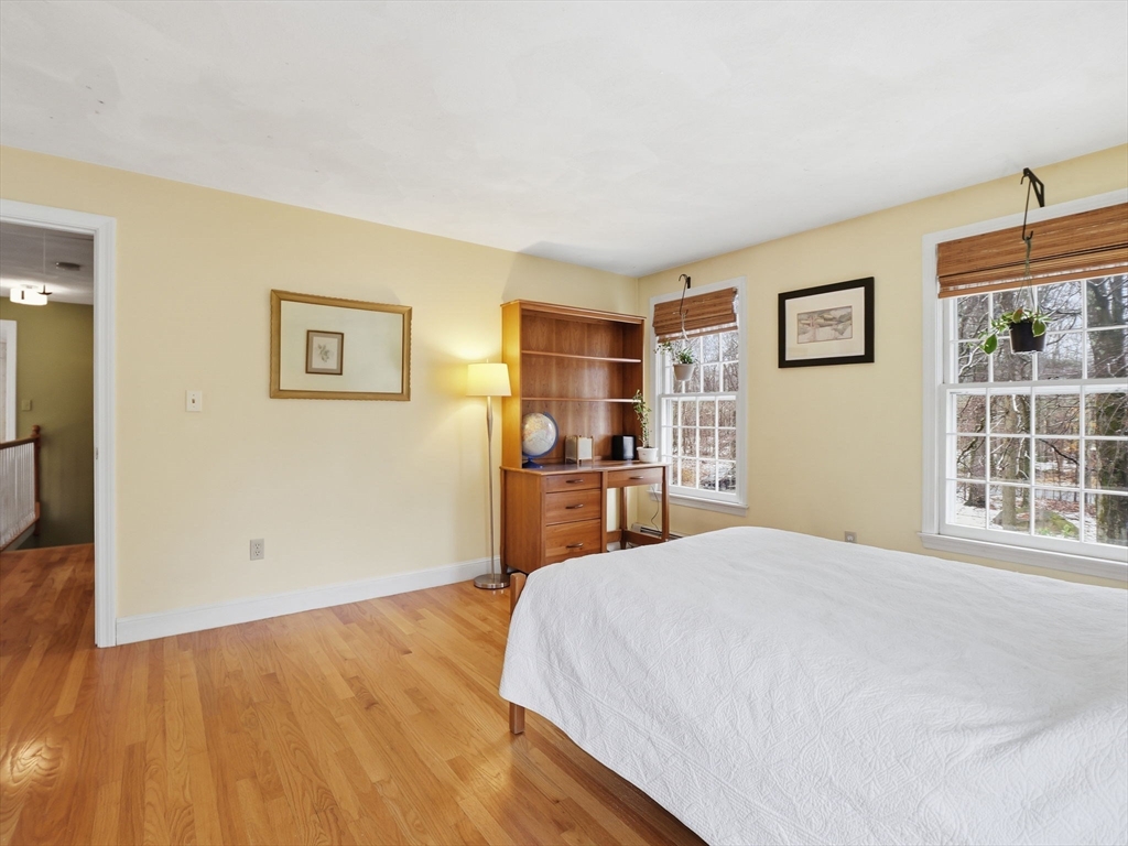 10 Berkeley Lane Andover, MA 01810 - Photo 31 of 42 a bedroom with a large bed and a window