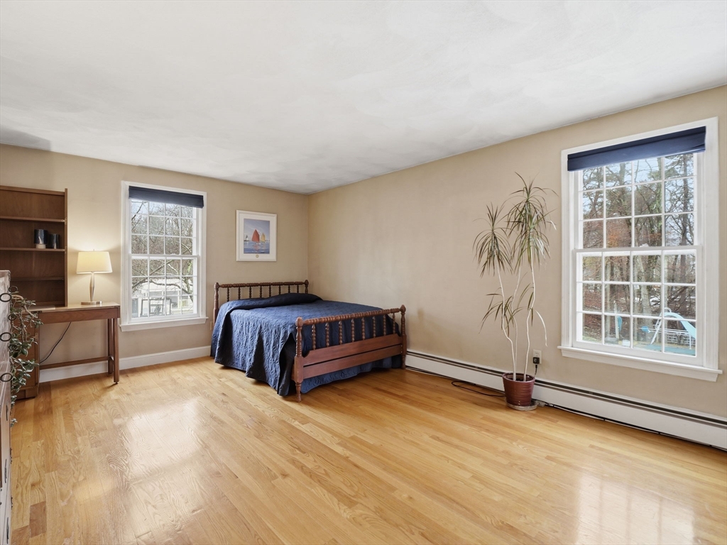 10 Berkeley Lane Andover, MA 01810 - Photo 32 of 42 a bedroom with a bed and window