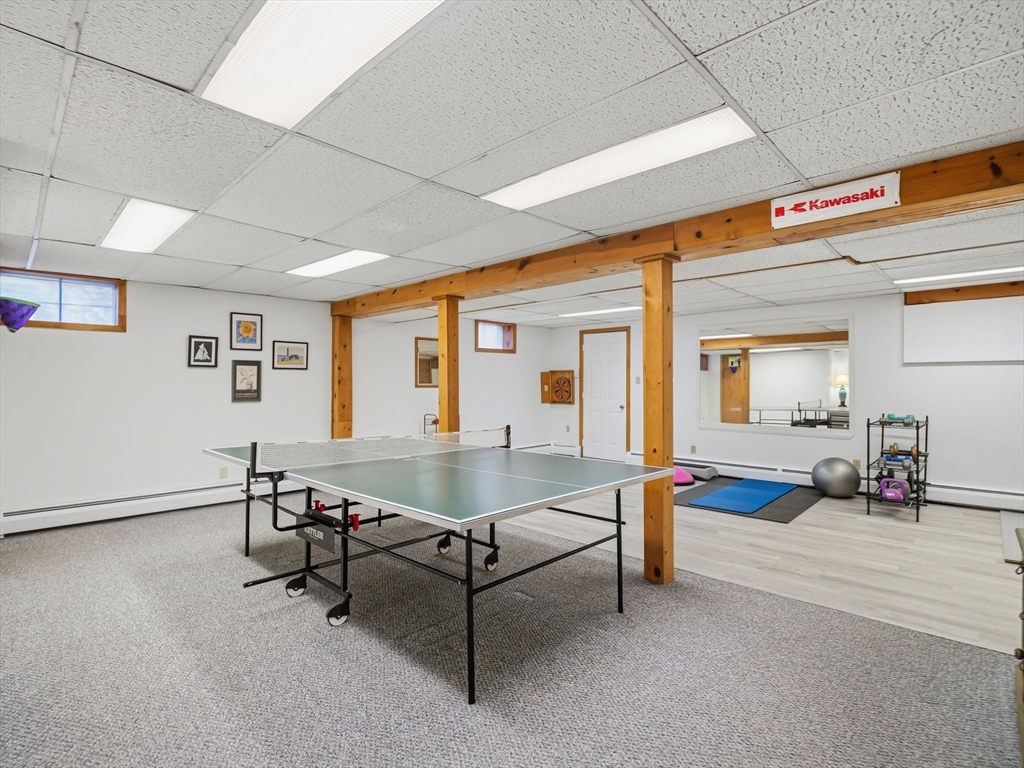 10 Berkeley Lane Andover, MA 01810 - Photo 34 of 42 a living room with furniture and white walls