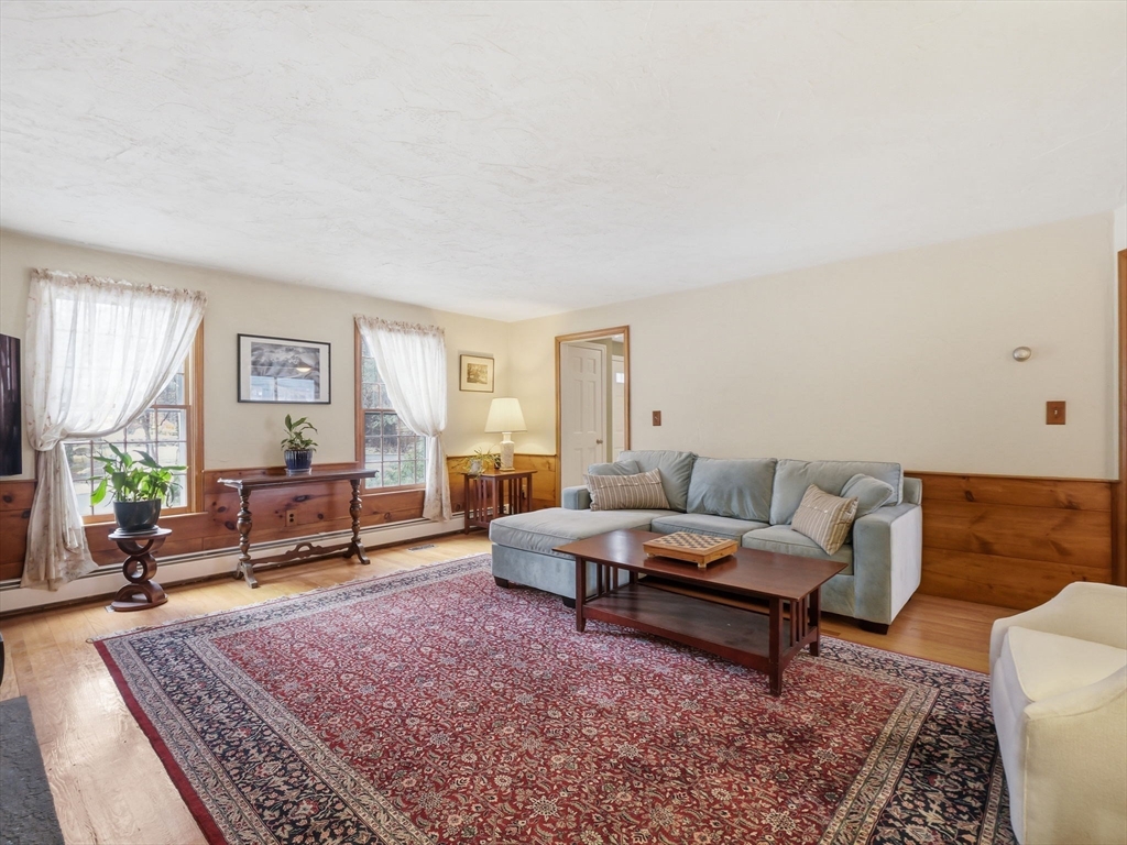 10 Berkeley Lane Andover, MA 01810 - Photo 10 of 42 a living room with furniture and a rug