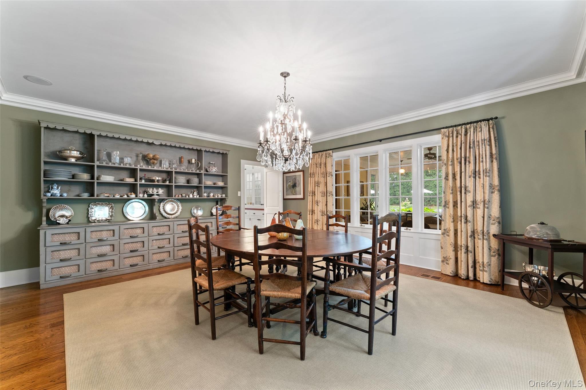 65 Garden Road Scarsdale, NY 10583 - Photo 15 of 48 a view of a dining room with furniture and chandelier