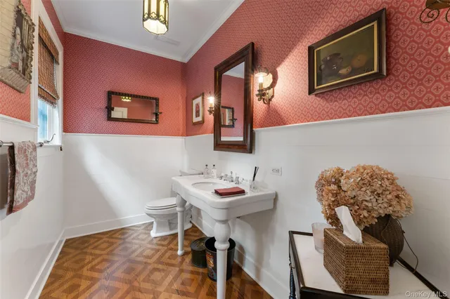a kitchen with stainless steel appliances granite countertop a stove and a wooden floors