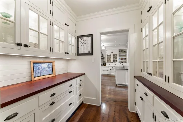 a room with a wooden floor and a book shelf