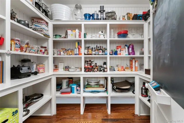 a room with furniture a rug and a window