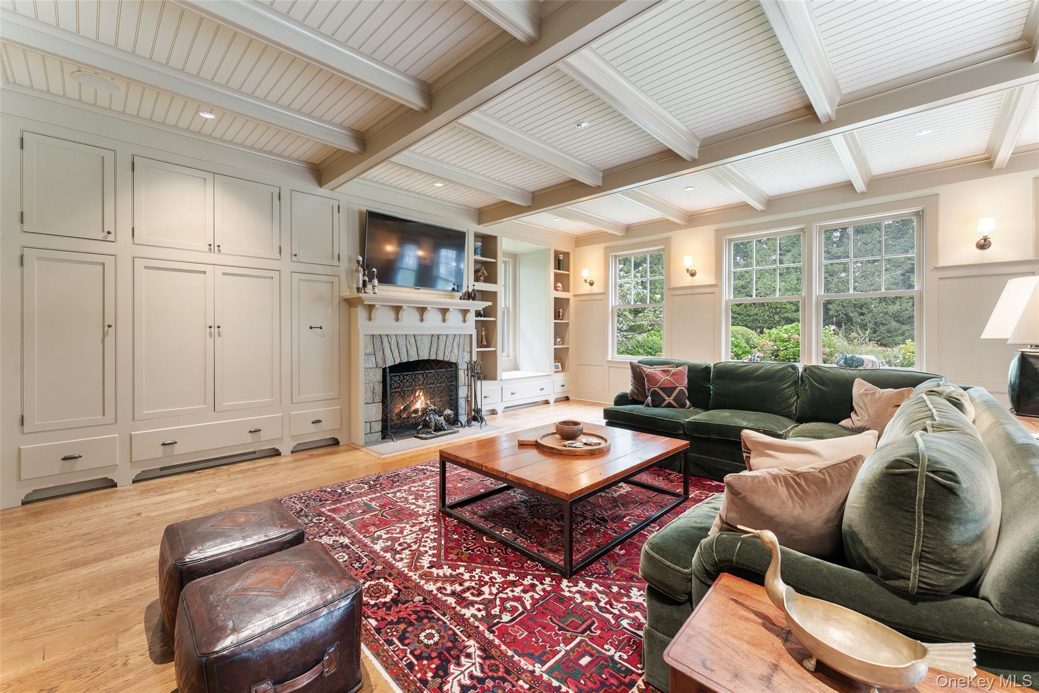 65 Garden Road Scarsdale, NY 10583 - Photo 26 of 48 a living room with furniture a fireplace and a table