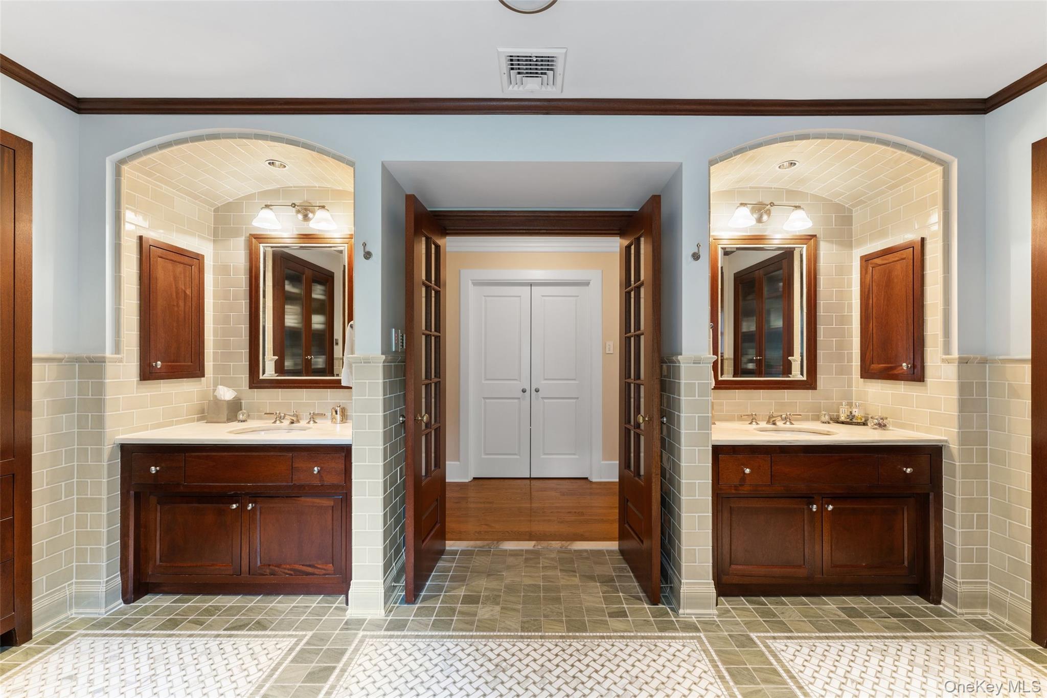 65 Garden Road Scarsdale, NY 10583 - Photo 35 of 48 a spacious bathroom with a granite countertop sink and a mirror