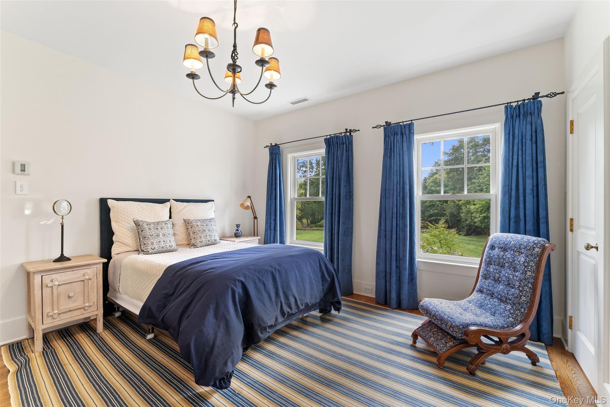 65 Garden Road Scarsdale, NY 10583 - Photo 44 of 48 a bedroom with a bed and wooden floor