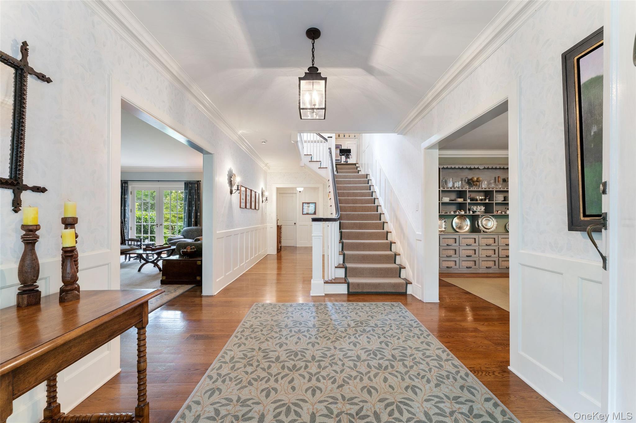 65 Garden Road Scarsdale, NY 10583 - Photo 9 of 48 a view of a hallway with wooden floor and windows