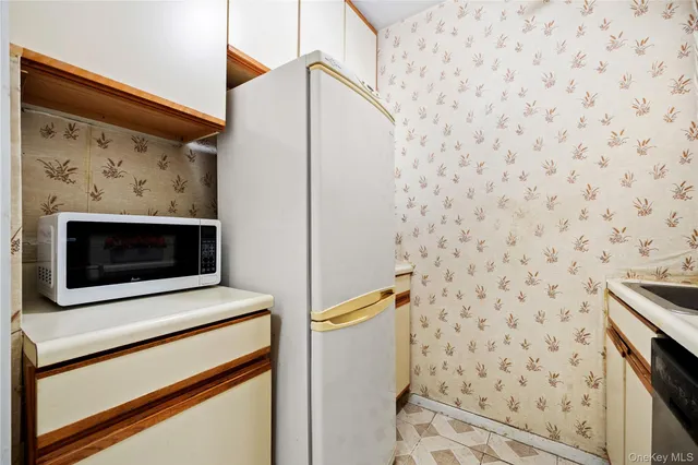 a bathroom with a shower and a stove